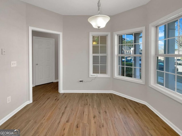 2555 Flat Shoals Rd Unit 3405, Atlanta, GA 30349 - unfurnished dining area featuring wood finished floors