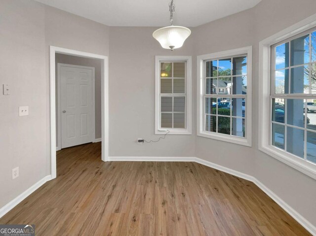2555 Flat Shoals Rd Unit 3405, Atlanta, GA 30349 - unfurnished dining area featuring wood finished floors