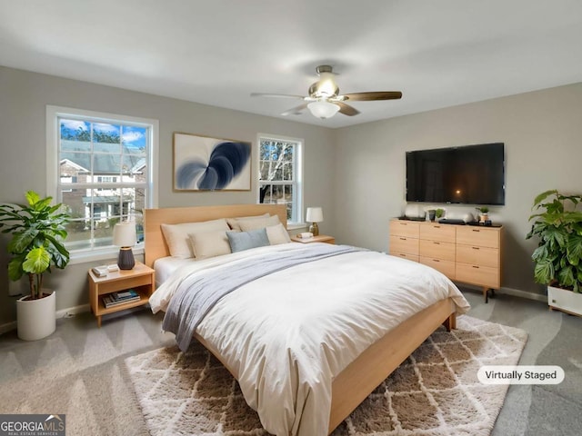 2555 Flat Shoals Rd Unit 3405, Atlanta, GA 30349 - bedroom with light colored carpet and ceiling fan