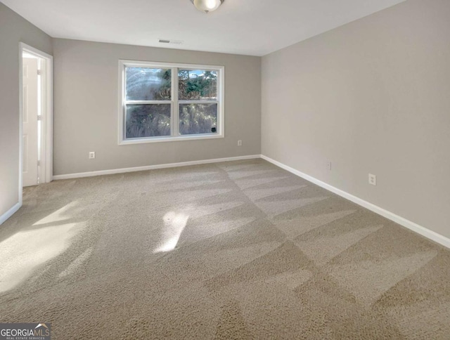2555 Flat Shoals Rd Unit 3405, Atlanta, GA 30349 - spare room with baseboards and carpet flooring