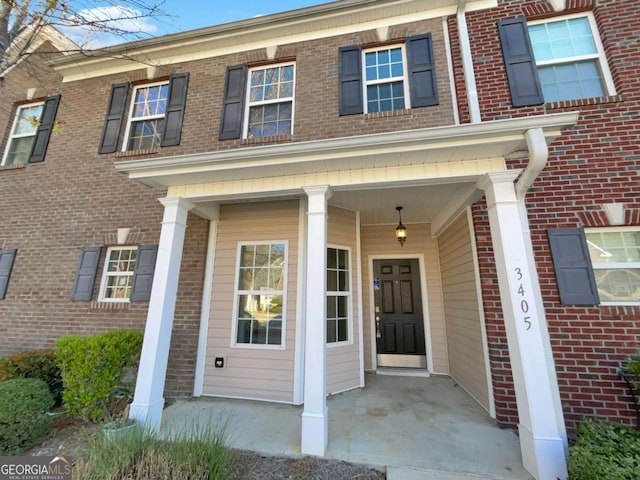 2555 Flat Shoals Rd Unit 3405, Atlanta, GA 30349 - entrance to property with brick siding and a porch