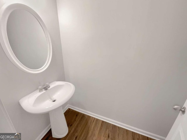 2555 Flat Shoals Rd Unit 3405, Atlanta, GA 30349 - bathroom featuring baseboards and wood finished floors