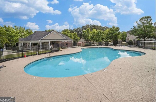 2555 Flat Shoals Rd Unit 3405, Atlanta, GA 30349 - community pool with a patio