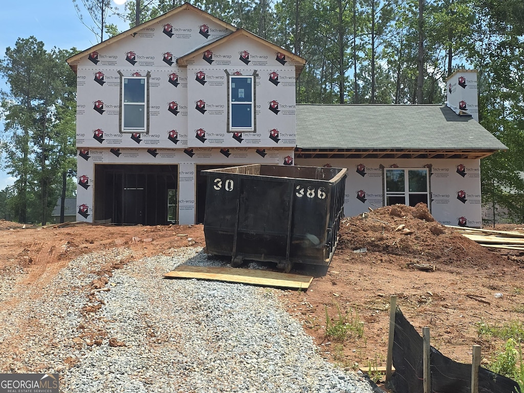 62 Armstrong Dr Unit 84, Mansfield, GA 30055 - property in mid-construction featuring driveway, a garage, and a chimney