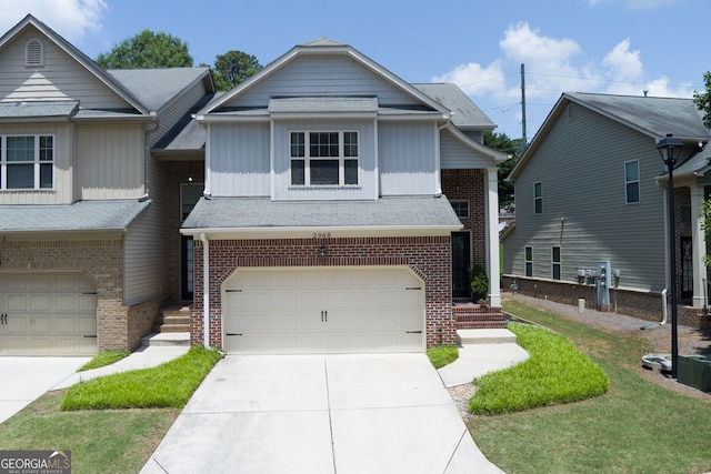 2968 Oshields Ct SW, Marietta, GA 30060 - view of property with a garage, board and batten siding, brick siding, and driveway
