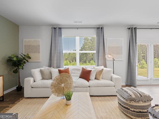 8215 Coldstream Dr, Fairburn, GA 30213 - living area with plenty of natural light and wood finished floors