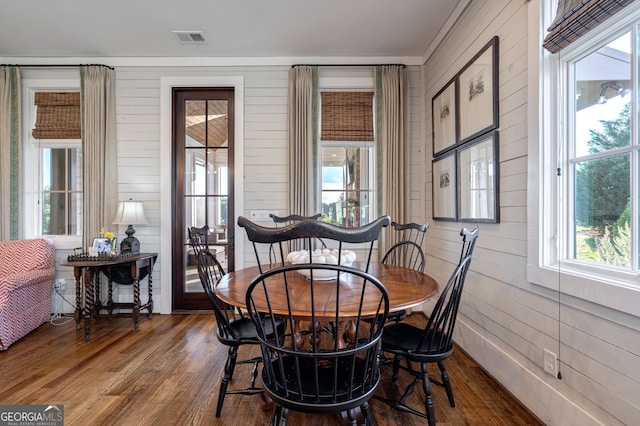 3315 Chandler Rd, Good Hope, GA 30641 - dining room featuring wood finished floors, wood walls, and crown molding