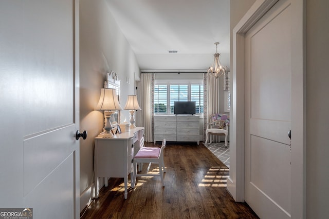 3315 Chandler Rd, Good Hope, GA 30641 - hallway with dark wood-style floors and a chandelier