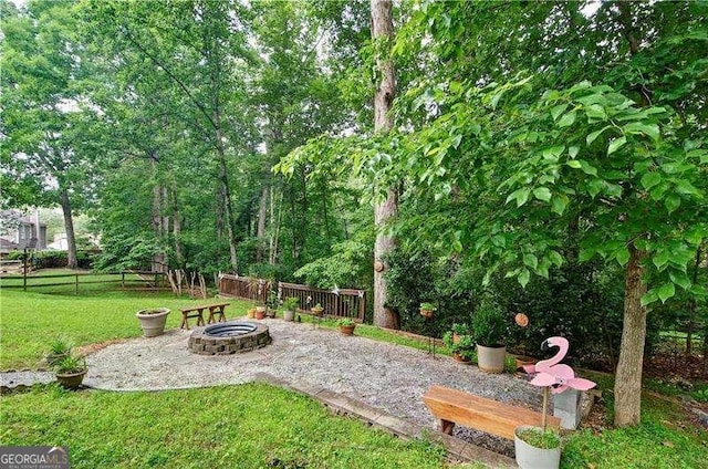2212 Mcquiston Dr SW, Marietta, GA 30064 - view of yard featuring an outdoor fire pit and a patio