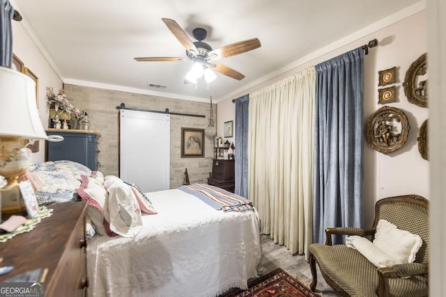4009 Gray Hwy, Gray, GA 31032 - bedroom with a barn door, crown molding, ceiling fan, and wood finished floors