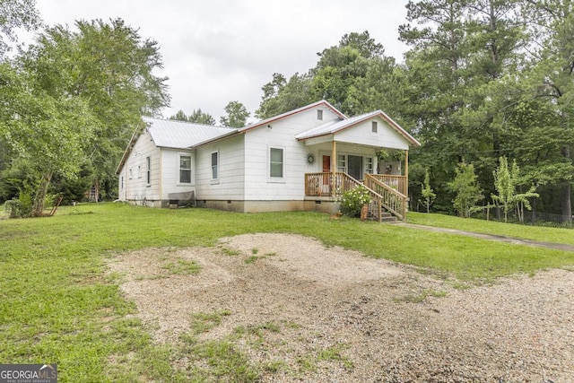 4009 Gray Hwy, Gray, GA 31032 - bungalow-style home featuring crawl space, a porch, a front yard, and metal roof