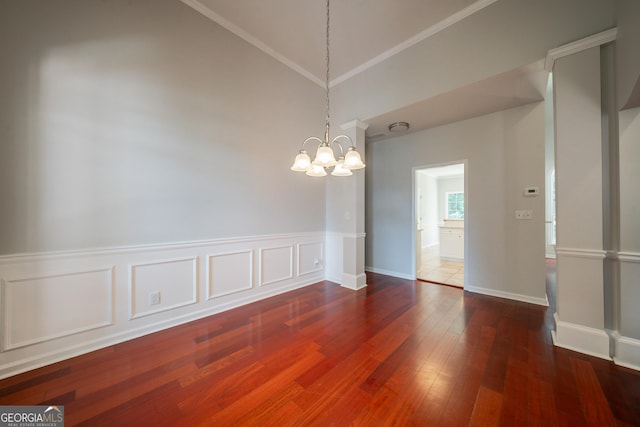 70 Sylvia Cir, Covington, GA 30016 - unfurnished room featuring a chandelier, wood finished floors, ornamental molding, high vaulted ceiling, and baseboards