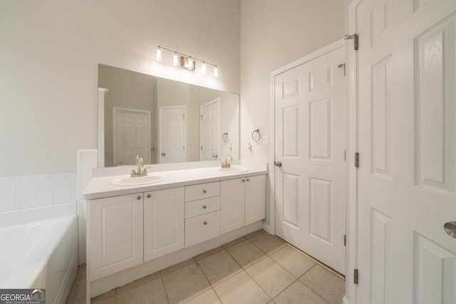 70 Sylvia Cir, Covington, GA 30016 - full bathroom featuring double vanity, tile patterned floors, and a bath