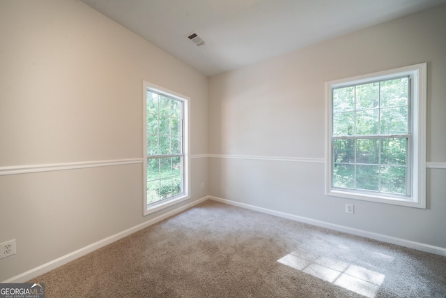 70 Sylvia Cir, Covington, GA 30016 - spare room featuring plenty of natural light, carpet, and baseboards