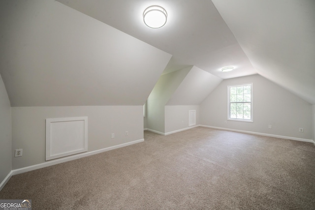 70 Sylvia Cir, Covington, GA 30016 - additional living space featuring baseboards, vaulted ceiling, and carpet floors