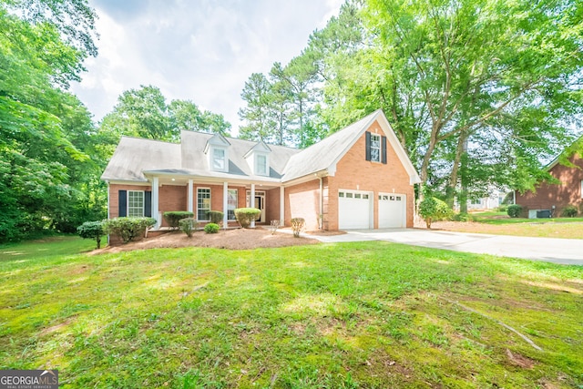 70 Sylvia Cir, Covington, GA 30016 - new england style home with brick siding, a front yard, driveway, a porch, and an attached garage