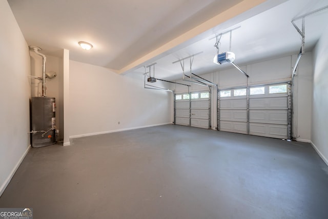 70 Sylvia Cir, Covington, GA 30016 - garage with gas water heater, a garage door opener, and baseboards