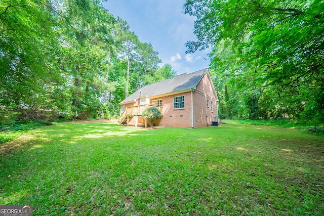 70 Sylvia Cir, Covington, GA 30016 - view of green lawn with stairway and central air condition unit