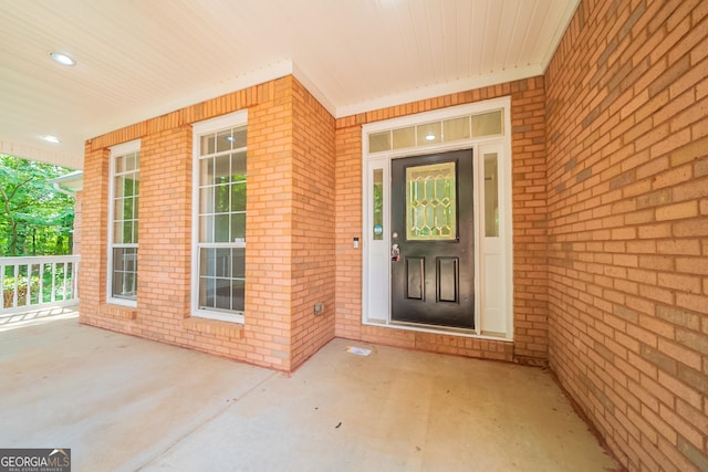 70 Sylvia Cir, Covington, GA 30016 - property entrance featuring covered porch and brick siding