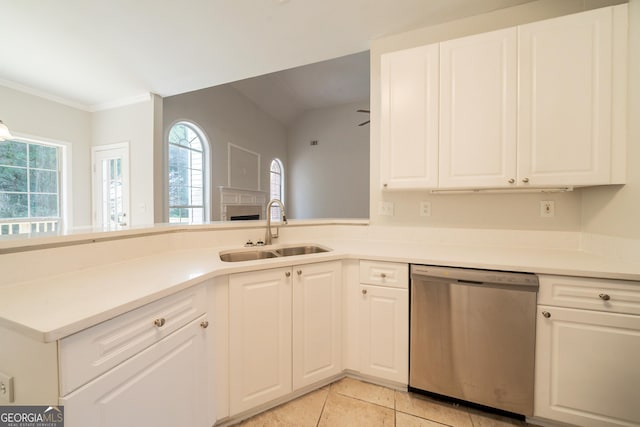 70 Sylvia Cir, Covington, GA 30016 - kitchen with dishwasher, a sink, white cabinetry, light countertops, and ornamental molding