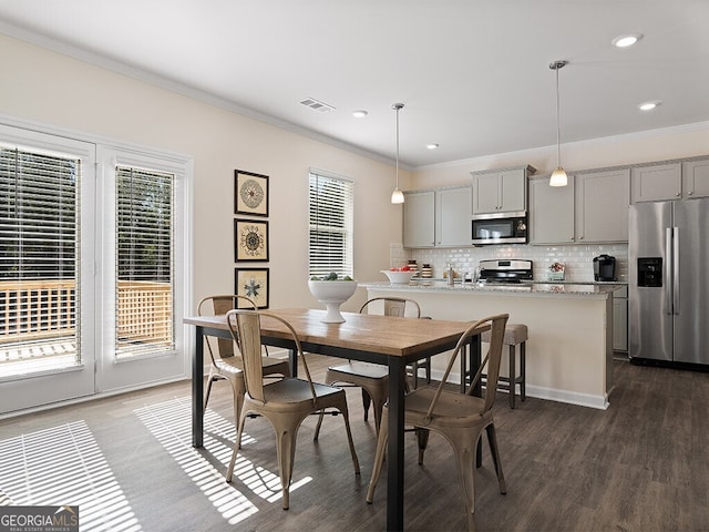 366 Lost Creek Blvd, Dallas, GA 30132 - dining area featuring healthy amount of natural light, crown molding, dark wood finished floors, and recessed lighting