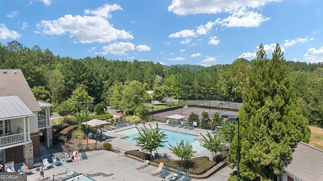 366 Lost Creek Blvd, Dallas, GA 30132 - community pool with a forest view and a patio area
