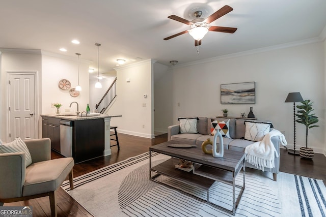 7850 Willoughby Ct, Alpharetta, GA 30005 - living area with ceiling fan, ornamental molding, dark wood-type flooring, recessed lighting, and stairs