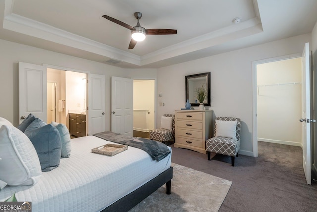 7850 Willoughby Ct, Alpharetta, GA 30005 - carpeted bedroom with a raised ceiling, a walk in closet, connected bathroom, crown molding, and a closet