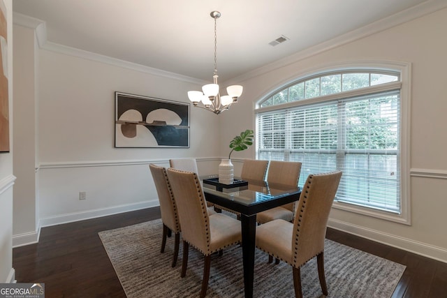 7850 Willoughby Ct, Alpharetta, GA 30005 - dining room with a chandelier, dark wood-style flooring, and crown molding