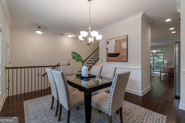 7850 Willoughby Ct, Alpharetta, GA 30005 - dining area featuring a chandelier, wood finished floors, recessed lighting, ornamental molding, and stairs