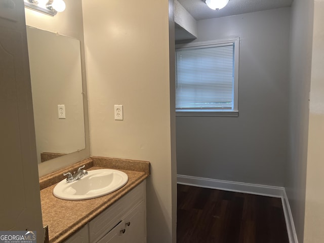 4196 Lehigh Blvd, Decatur, GA 30034 - bathroom featuring vanity, wood finished floors, and baseboards
