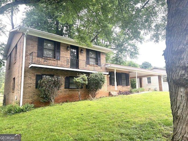 4196 Lehigh Blvd, Decatur, GA 30034 - split level home with a balcony, a front lawn, brick siding, and an attached carport