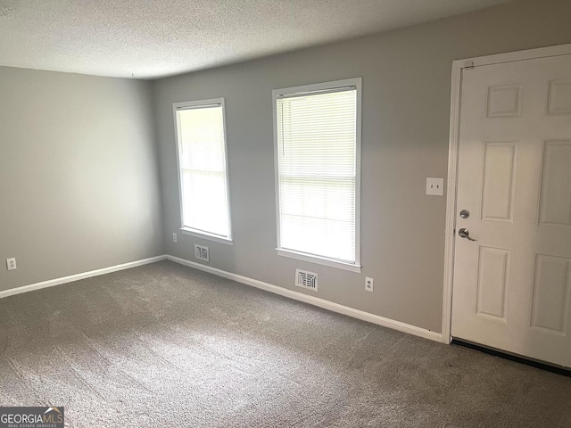 4196 Lehigh Blvd, Decatur, GA 30034 - empty room with carpet flooring, a textured ceiling, and baseboards