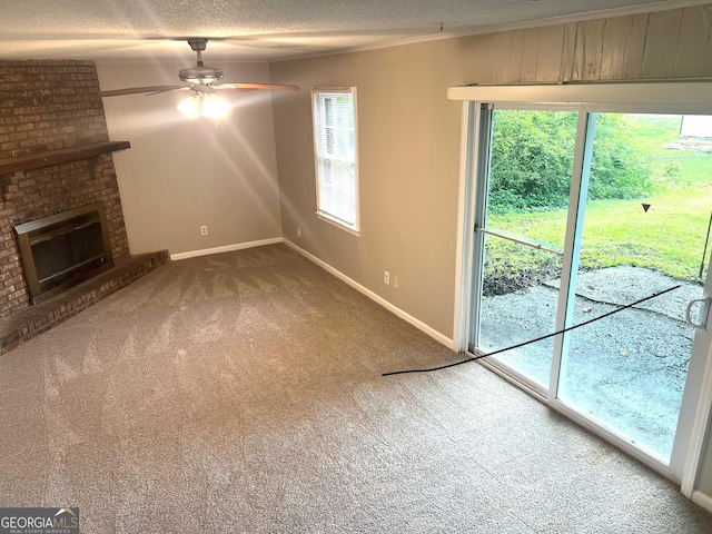 4196 Lehigh Blvd, Decatur, GA 30034 - unfurnished living room featuring carpet, ceiling fan, baseboards, a textured ceiling, and a fireplace
