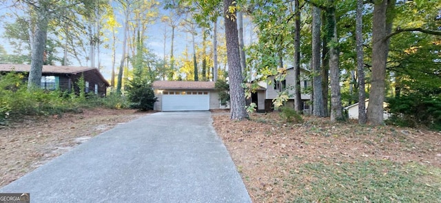 3226 Bruckner Blvd, Snellville, GA 30078 - split level home featuring driveway and an attached garage