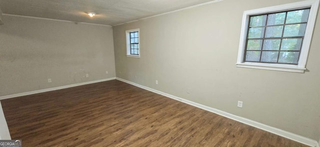 3226 Bruckner Blvd, Snellville, GA 30078 - empty room with crown molding, dark wood-type flooring, and baseboards