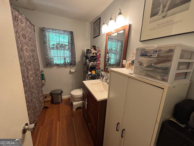 992 Tom Bell Rd, Cleveland, GA 30528 - bathroom with wood finished floors, vanity, toilet, baseboards, and curtained shower