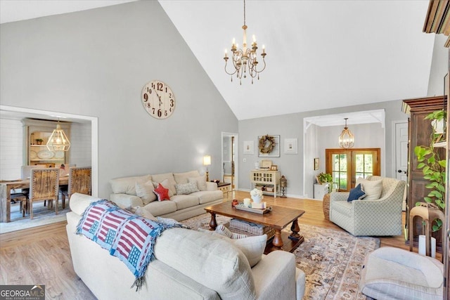 15 Split Oak Dr SW, Cartersville, GA 30120 - living area featuring a chandelier, high vaulted ceiling, and light wood-style flooring