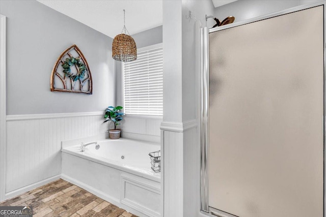 15 Split Oak Dr SW, Cartersville, GA 30120 - bathroom featuring a shower stall, a whirlpool tub, wainscoting, and wood finished floors