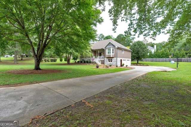 15 Split Oak Dr SW, Cartersville, GA 30120 - view of front facade with concrete driveway, an attached garage, and stone siding