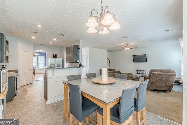 118 Surge Stone Ln, Stockbridge, GA 30281 - dining area featuring a chandelier, arched walkways, ceiling fan, a textured ceiling, and recessed lighting