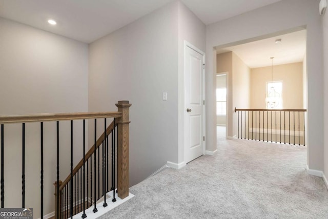 4000 Red Canoe Bnd, Lilburn, GA 30047 - hallway featuring an upstairs landing, carpet, and baseboards