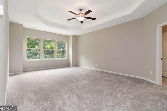 4000 Red Canoe Bnd, Lilburn, GA 30047 - carpeted empty room featuring a tray ceiling, ceiling fan, and baseboards