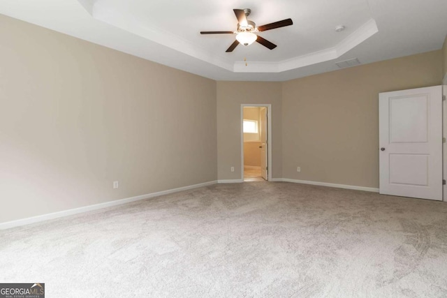 4000 Red Canoe Bnd, Lilburn, GA 30047 - unfurnished room featuring a tray ceiling, ceiling fan, carpet floors, and baseboards