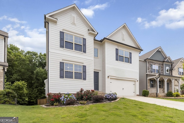 4000 Red Canoe Bnd, Lilburn, GA 30047 - view of front of home with concrete driveway, a front yard, and a garage