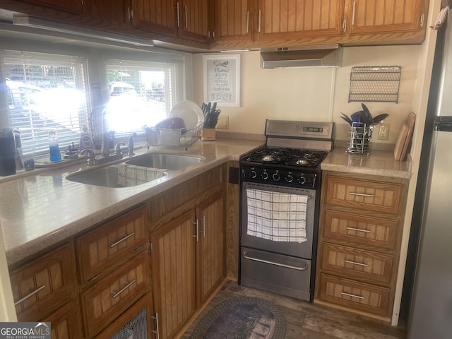 32 Yogi Bear Blvd, Cleveland, GA 30528 - kitchen featuring appliances with stainless steel finishes, wall chimney range hood, light countertops, and brown cabinets