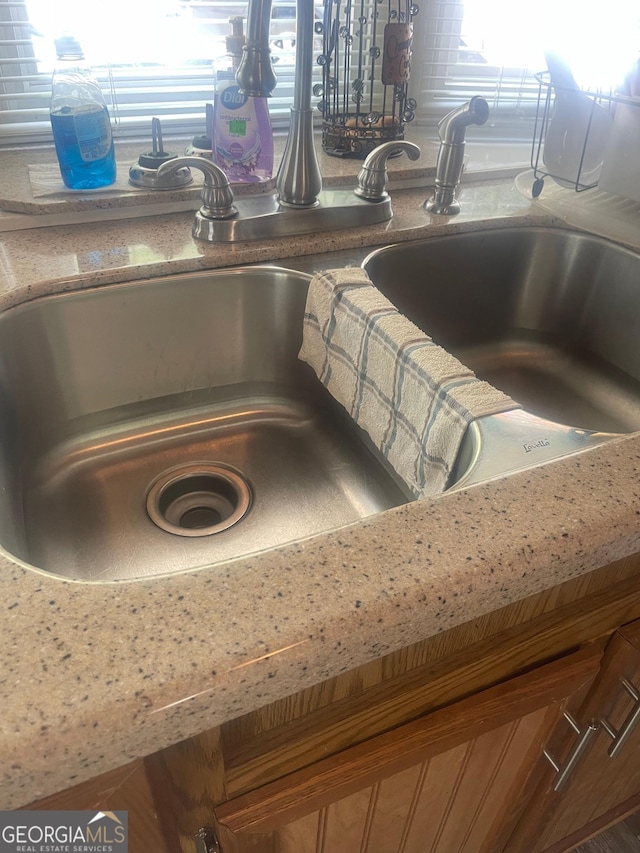 32 Yogi Bear Blvd, Cleveland, GA 30528 - kitchen view of brown cabinetry and a sink