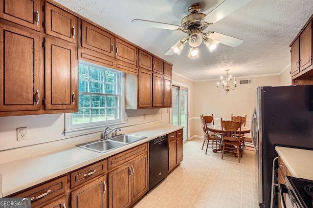 1739 Brandy Woods Trl SE, Conyers, GA 30013 - kitchen with stainless steel appliances, a sink, a ceiling fan, a chandelier, and brown cabinets