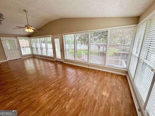 198 Swift Creek Rd, Cordele, GA 31015 - unfurnished sunroom featuring lofted ceiling and plenty of natural light