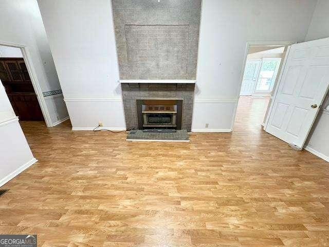 198 Swift Creek Rd, Cordele, GA 31015 - unfurnished living room featuring baseboards and wood finished floors
